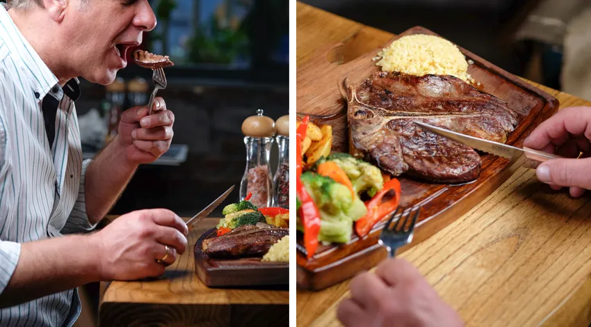 Bir adam kestiği bifteği yemek üzere, şık bir restoran ortamı